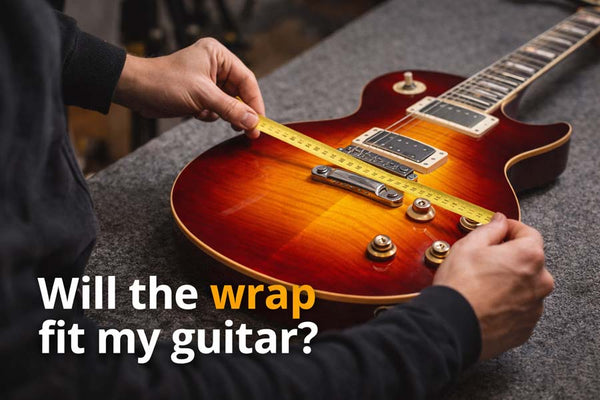 vinyl wrap guitar length requirements – measuring an electric guitar body with a tape measure to check if a guitar skin will fit