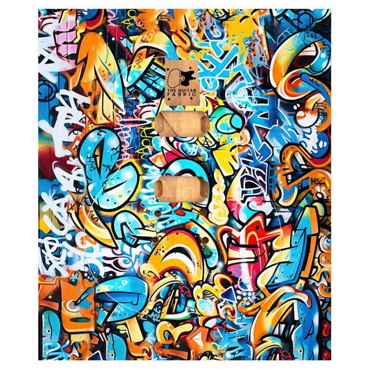 Graffiti Guitar Skin flat lay showing vibrant multicolored street art design with bold letters and shapes.