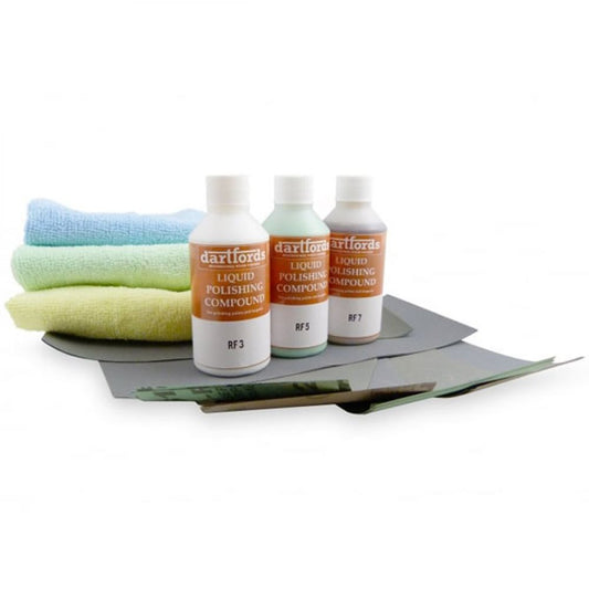 Complete Hand Polishing Kit displayed flat showing three liquid compound bottles, microfibre cloths, and abrasive papers