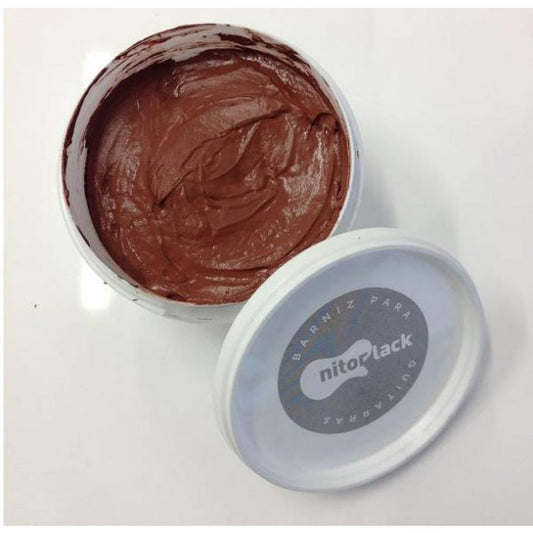 Waterbased mahogany grain filler in open container showing rich reddish-brown paste with swirled texture and lid