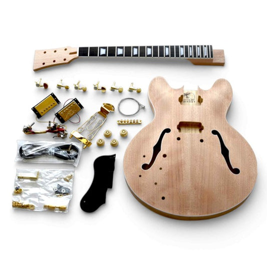 Left-handed ES kit components showing unfinished semi-hollow mahogany body, mahogany neck with rosewood fretboard, black pickguard, gold hardware, electronics, and gold tuning pegs machine.