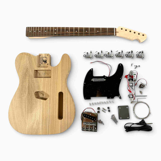 Kit Tele ash body with ebony fretboard neck, tuning pegs, pickguard, and hardware components laid flat.