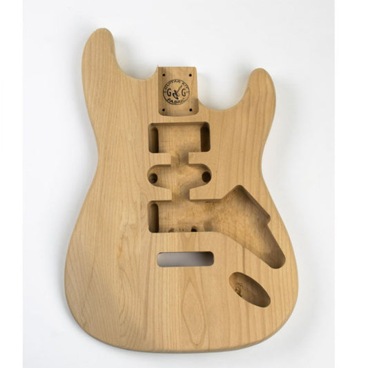 Strat Alder guitar body front view showing routed cavities for pickups, bridge, and electronics