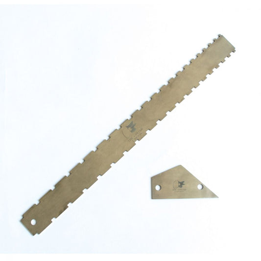 Notched straight edge and fret rocker tools displayed flat on white background
