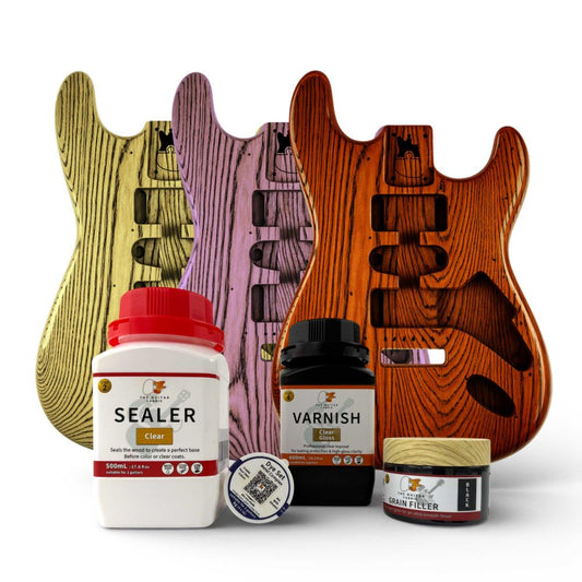 Translucent Guitar Finish Kit with three finished guitar bodies in yellow, purple, and red-orange showing black grain effect.