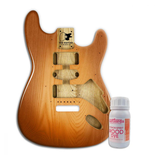 Light Orange alcohol-base wood dye bottle displayed next to finished guitar body showing applied color