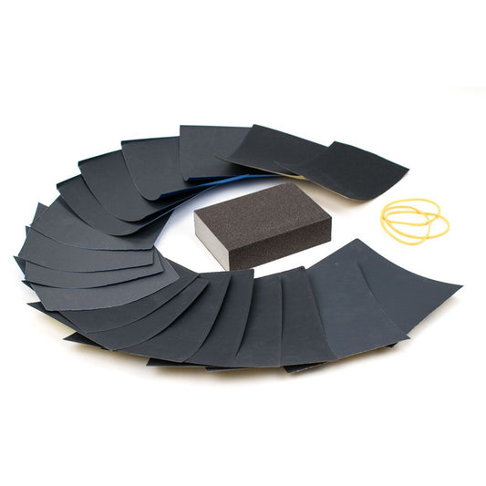 Sanding Set P240 to P1500 with dual-grit sanding block, assorted sandpaper sheets, and yellow elastics displayed flat.