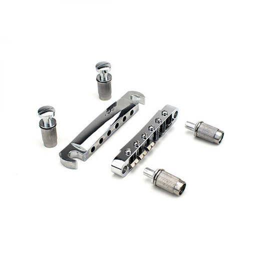 Bridge Tune-O-Matic LP chrome finish displayed with all included components and accessories laid out flat.