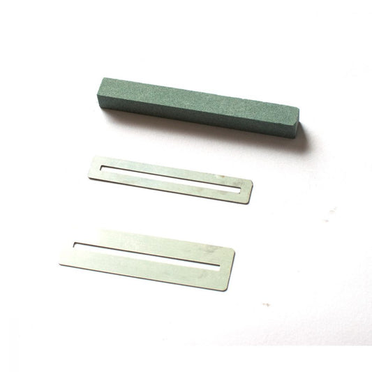 Guitar Repair set whetstone and stainless steel fret protector plates displayed separately on white background