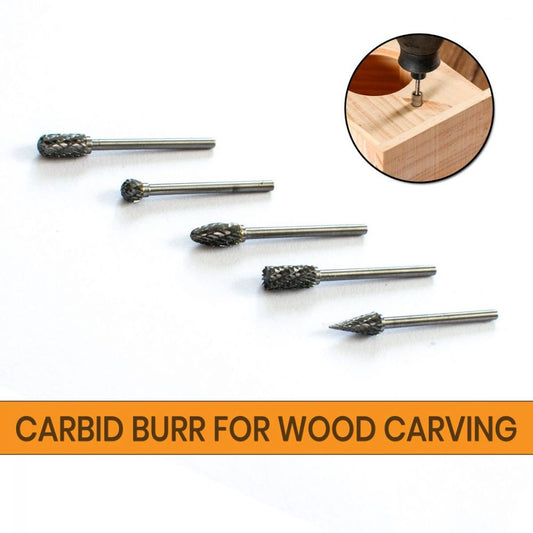 Five tungsten carbid burrs with short cut lengths in cylinder, ball, cone, and flame shapes arranged by size