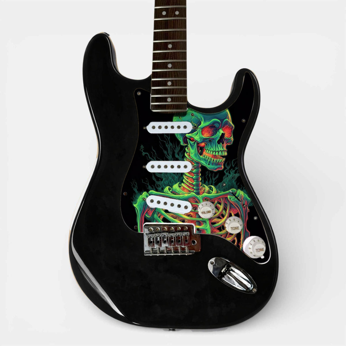 Black ST-style guitar with the loaded pickguard printed with a skull artwork