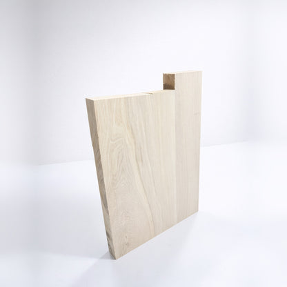 Ash body blank standing, showing the 45 mm thickness and the longer upper horn piece