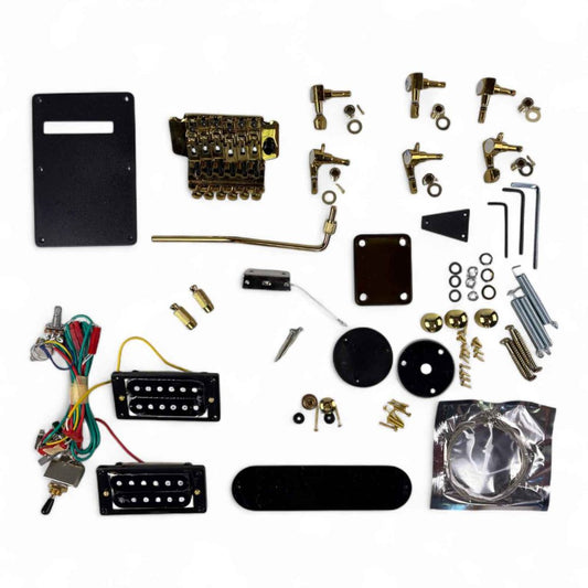 Gold Tone Razor guitar parts full set laid flat showing tremolo bridge, pickups, tuners, knobs, and electronics from above