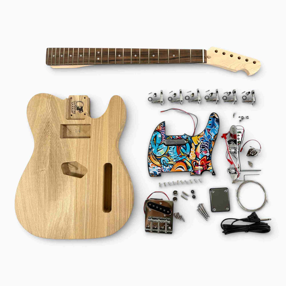 TL-style guitar kit laid out: ash body, neck, hardware and the custom artwork pickguard