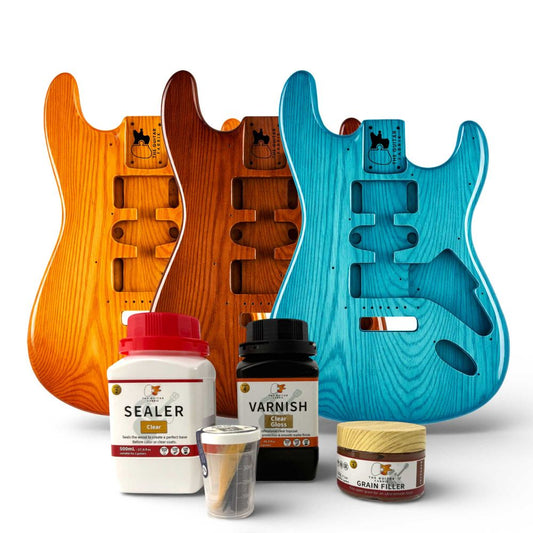 Complete Guitar Finishing Kit with sealer, varnish, grain filler and three mahogany bodies in amber, red and blue.